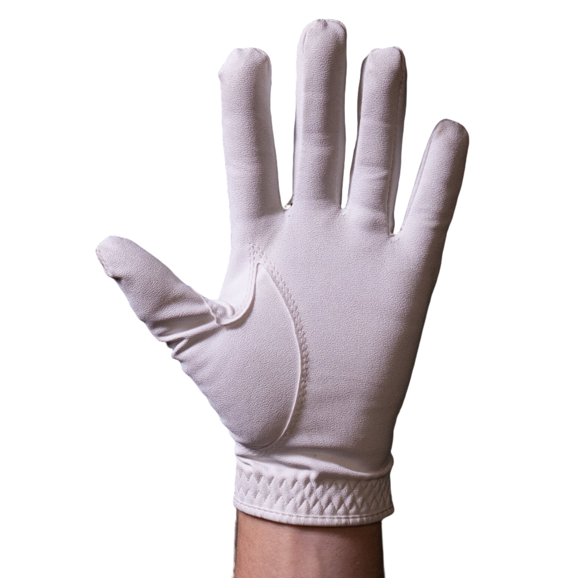 White glove on a hand against a dark tiled wall